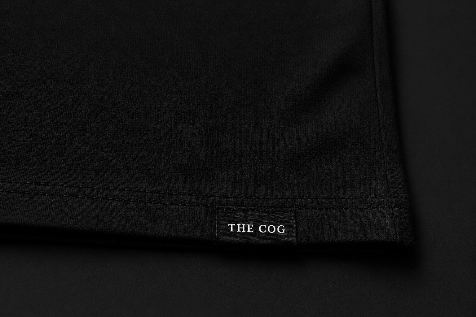 Hem tag woven with THE COG wordmark